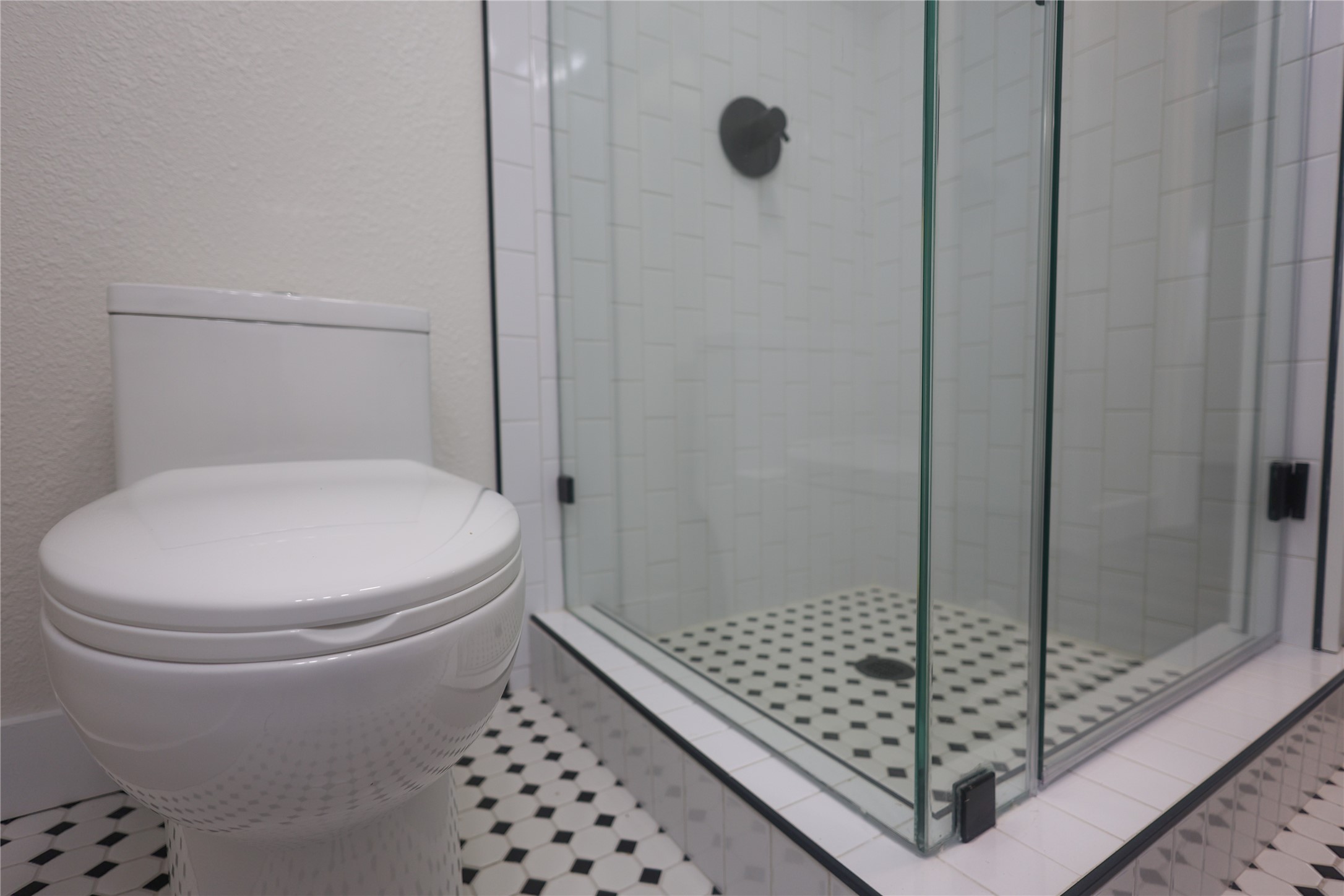 602 Higgins Street Humble, TX 77338 - Photo 24 of 39 a bathroom with a toilet and a shower