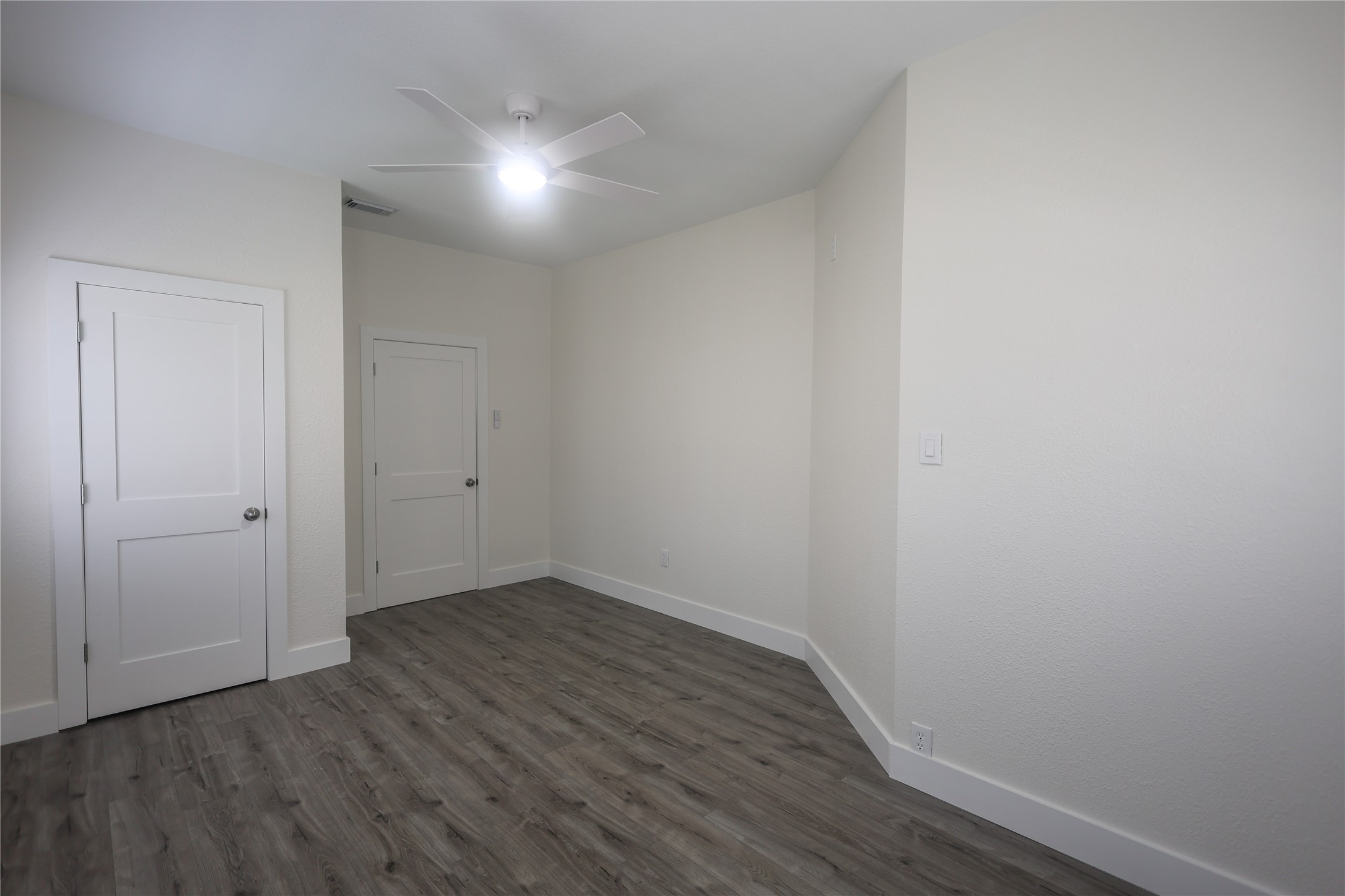 602 Higgins Street Humble, TX 77338 - Photo 26 of 39 a view of an empty room with wooden floor