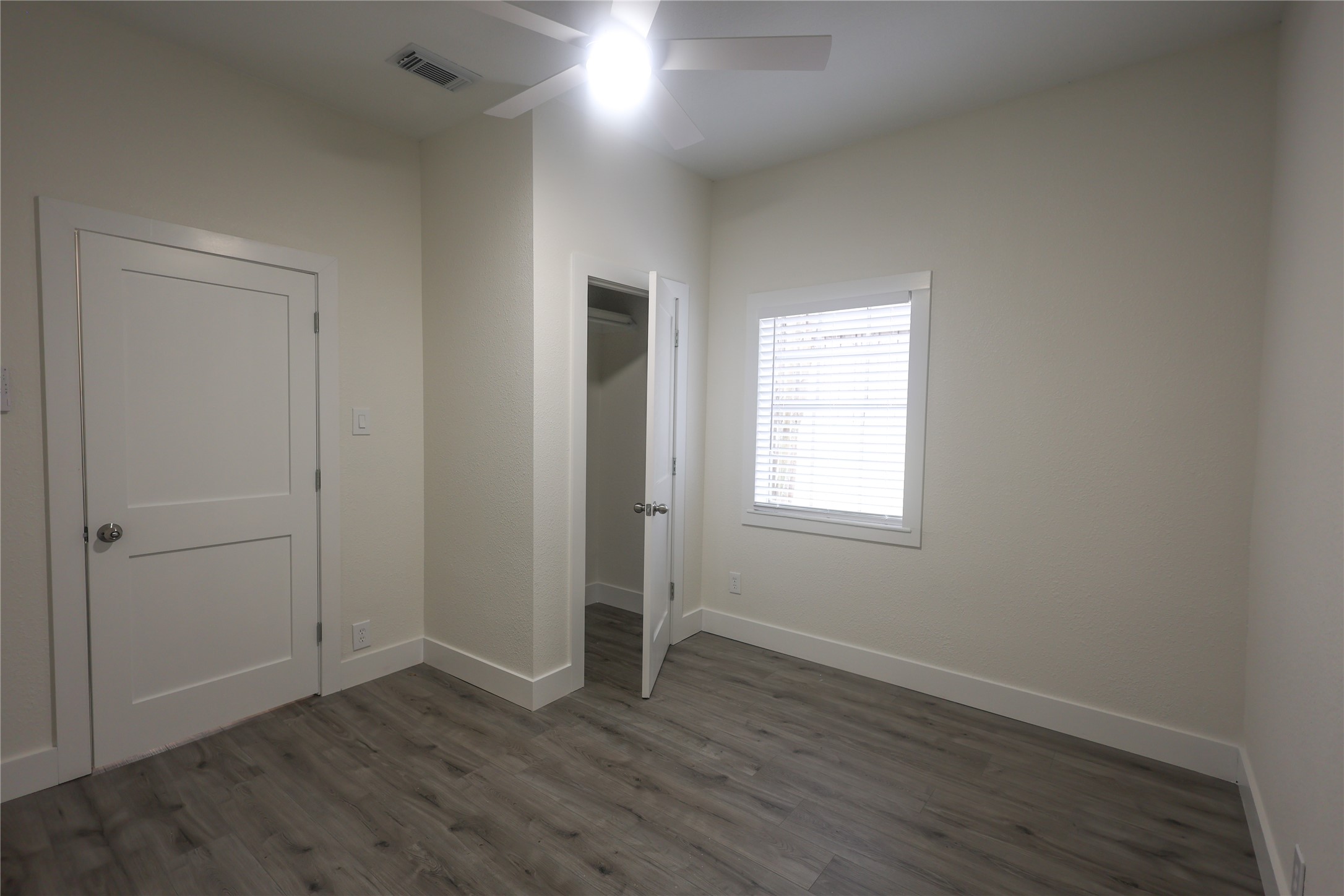 602 Higgins Street Humble, TX 77338 - Photo 29 of 39 an empty room with wooden floor and window