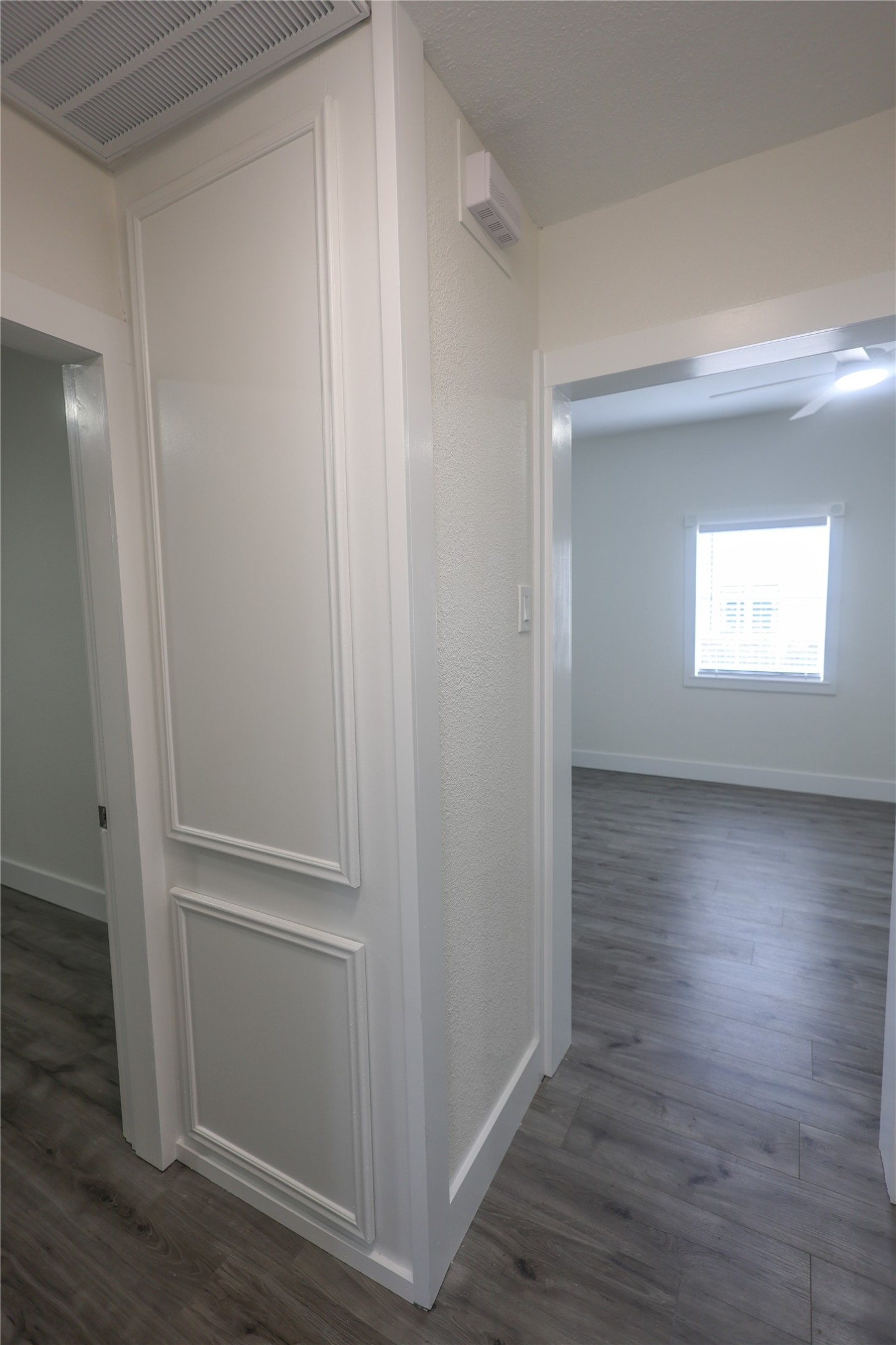 602 Higgins Street Humble, TX 77338 - Photo 32 of 39 a view of an empty room with wooden floor and a window