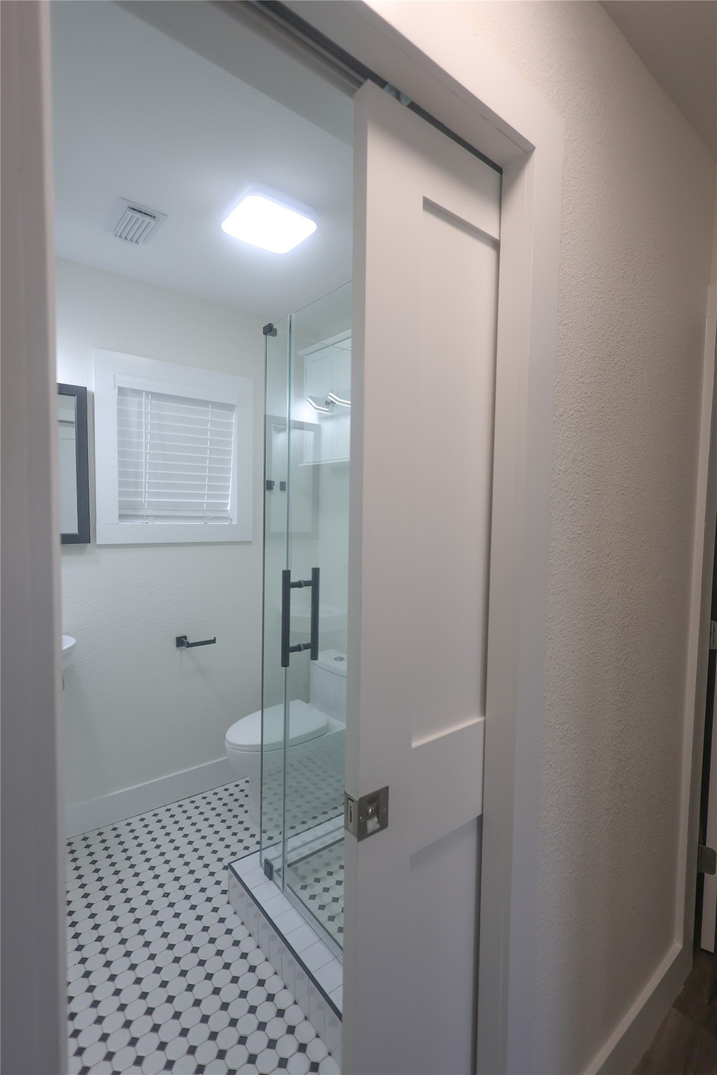 602 Higgins Street Humble, TX 77338 - Photo 33 of 39 a bathroom with a shower