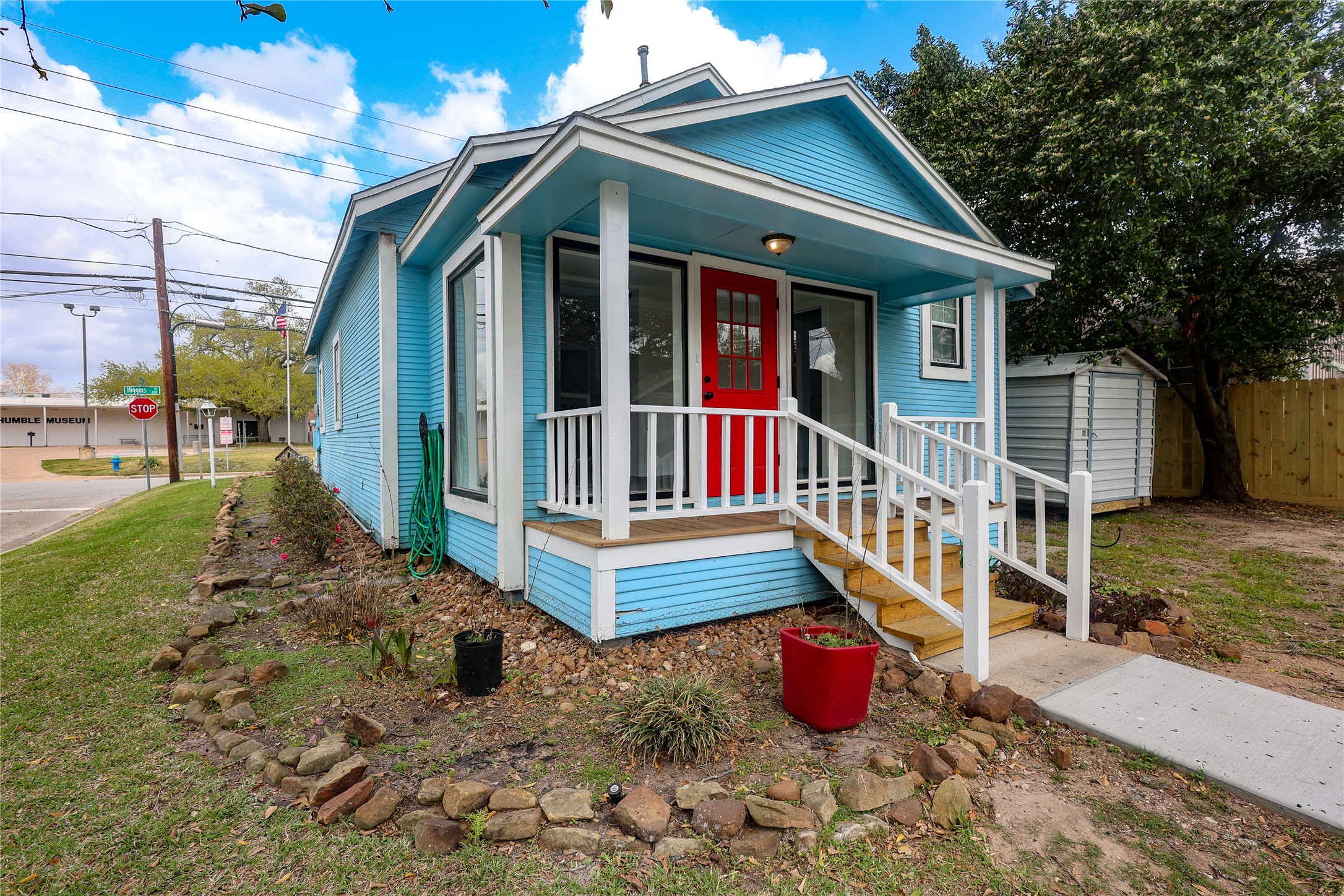 602 Higgins Street Humble, TX 77338 - Photo 34 of 39 a view of wooden house with large windows and wooden fence