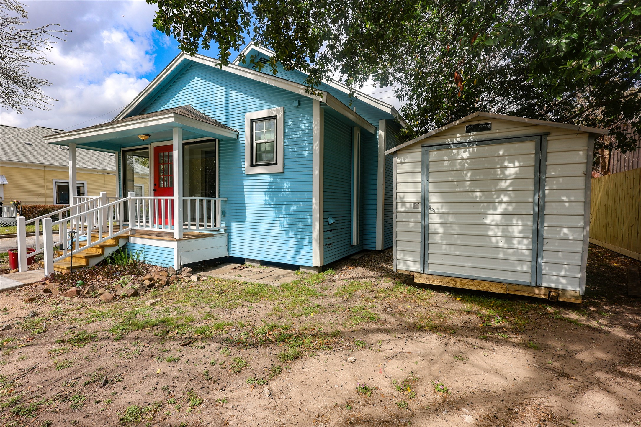 602 Higgins Street Humble, TX 77338 - Photo 36 of 39 a backyard of a house with barbeque oven table and chairs