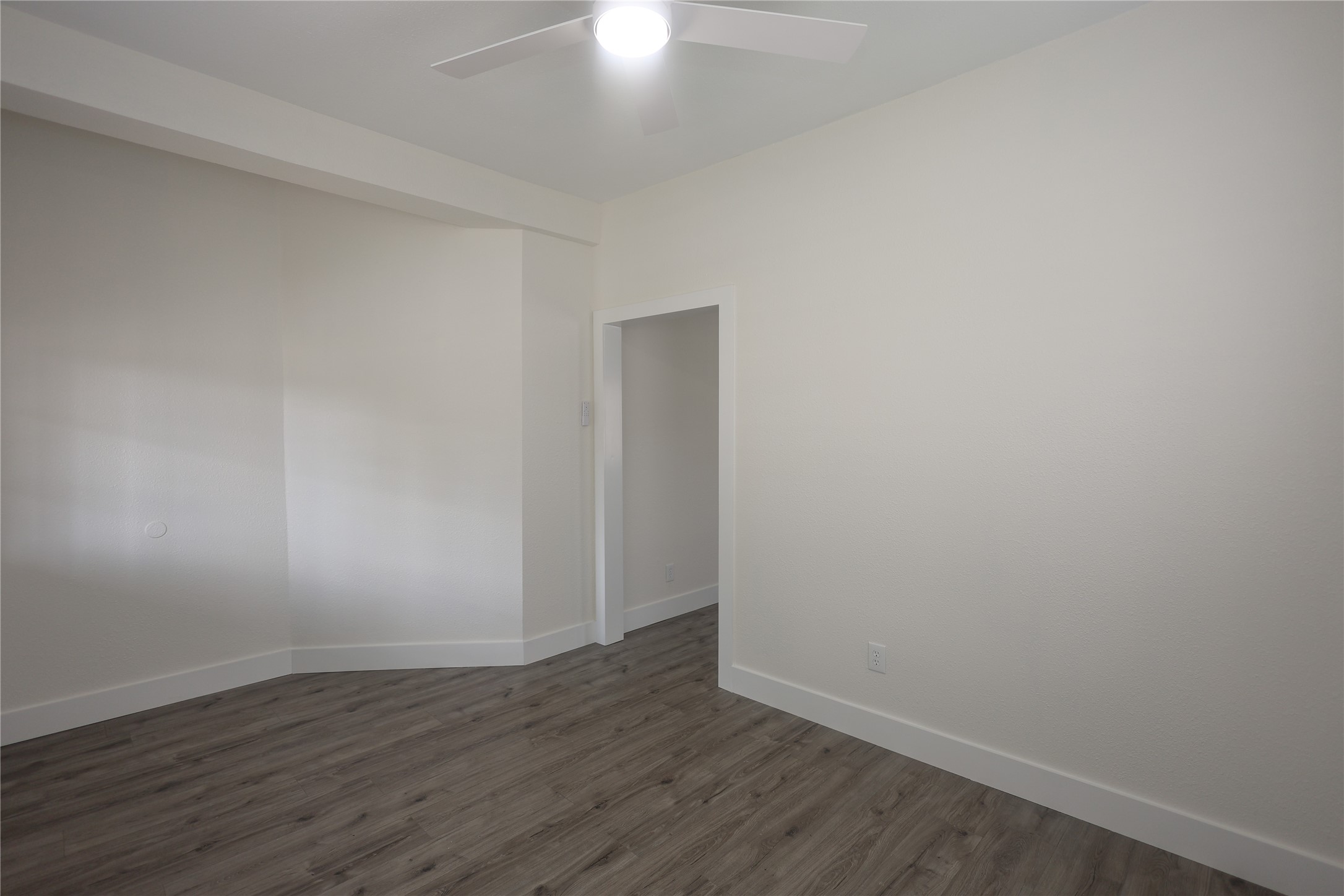 602 Higgins Street Humble, TX 77338 - Photo 6 of 39 a view of an empty room with wooden floor