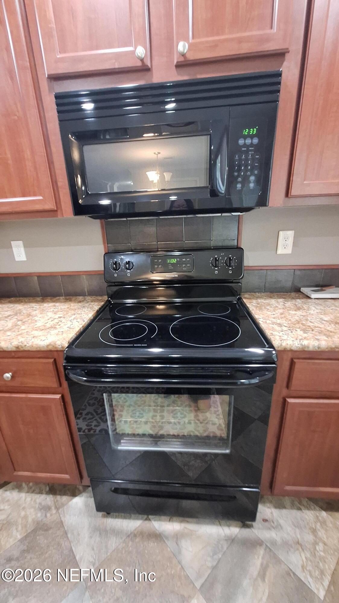 54144 Catherine Avenue Callahan, FL 32011 - Photo 41 of 50 Stove and Microwave