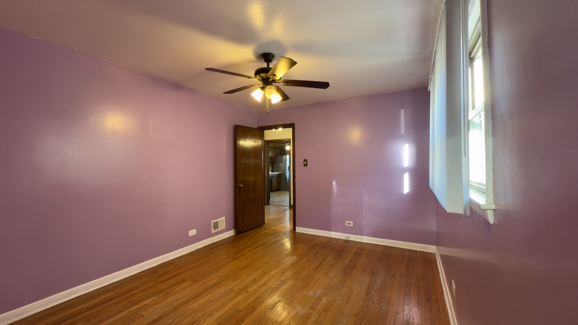 7127 South Ridgeway Avenue Chicago, IL 60629 - Photo 12 of 28 an empty room with windows and fan