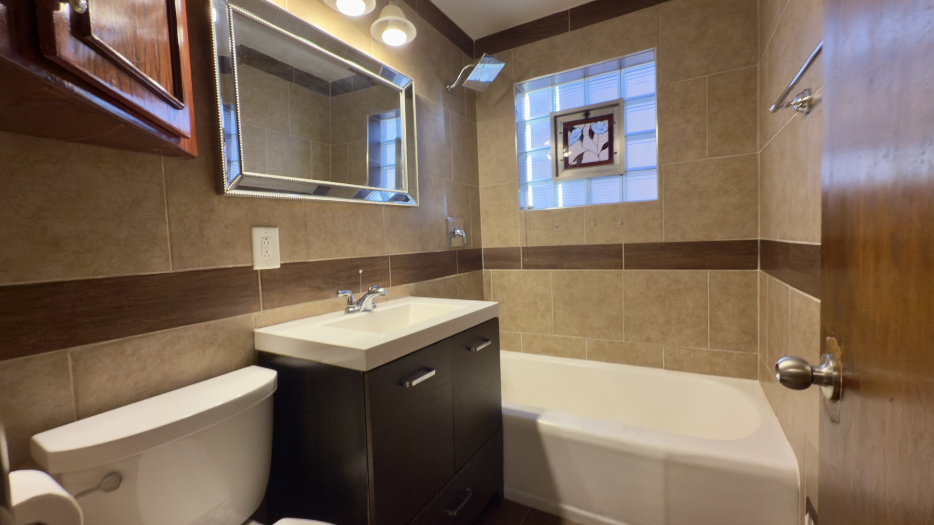 7127 South Ridgeway Avenue Chicago, IL 60629 - Photo 13 of 28 a bathroom with a sink and a bathtub