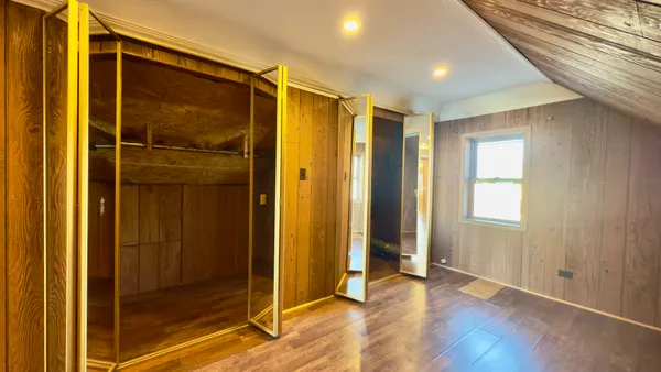 a view of entryway with wooden floor