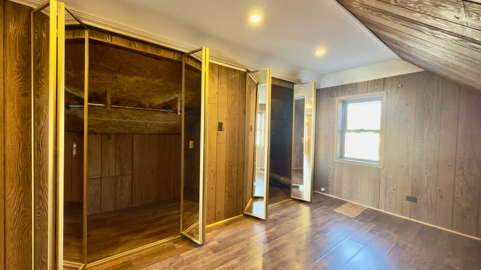 7127 South Ridgeway Avenue Chicago, IL 60629 - Photo 20 of 28 a view of an empty room with wooden floor and a window