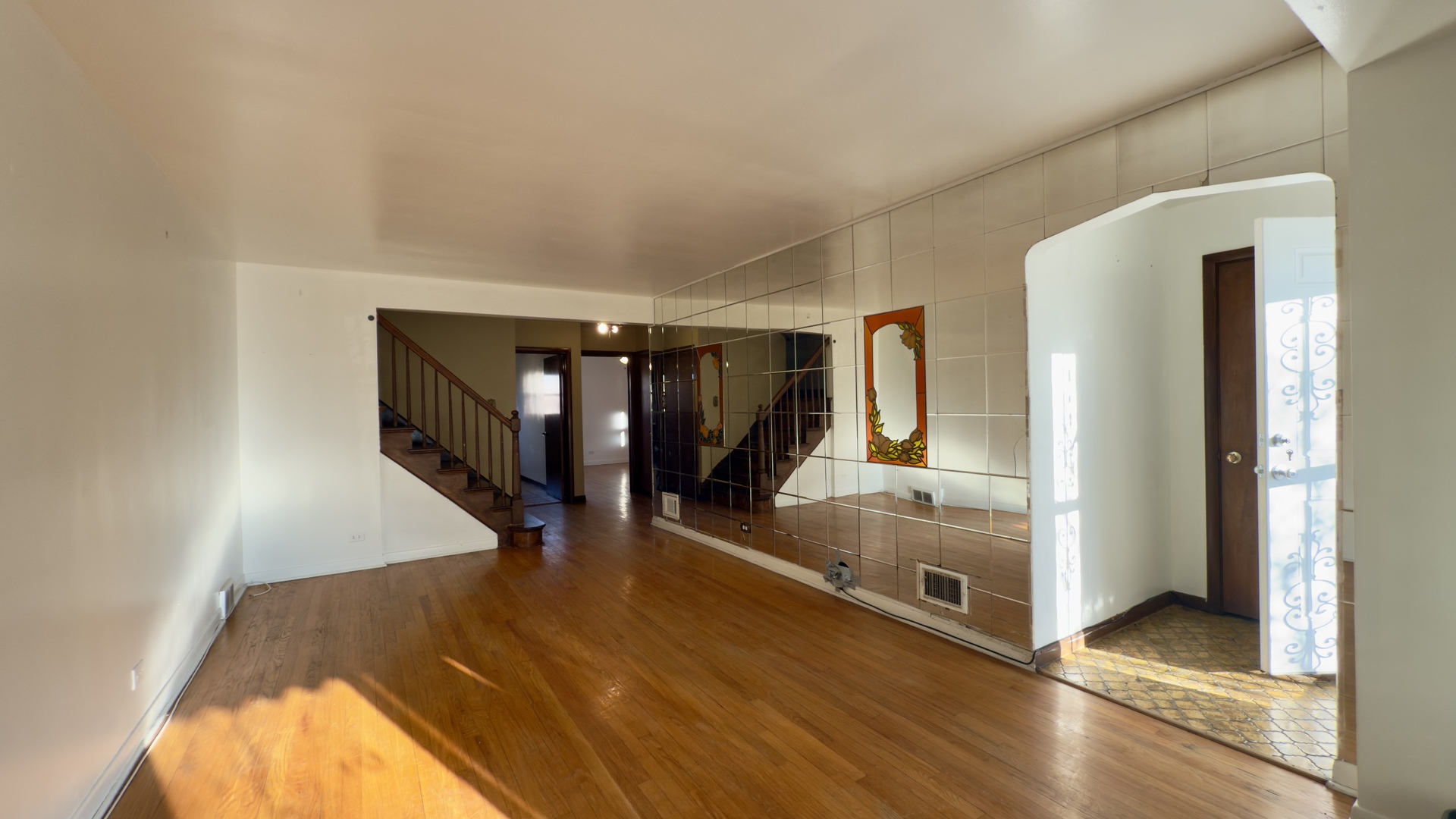 7127 South Ridgeway Avenue Chicago, IL 60629 - Photo 4 of 28 a view of a hallway with entryway wooden floor and front door