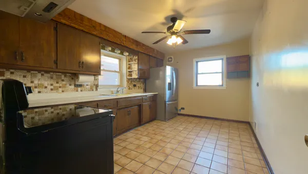 a bathroom with a sink a mirror and a shower