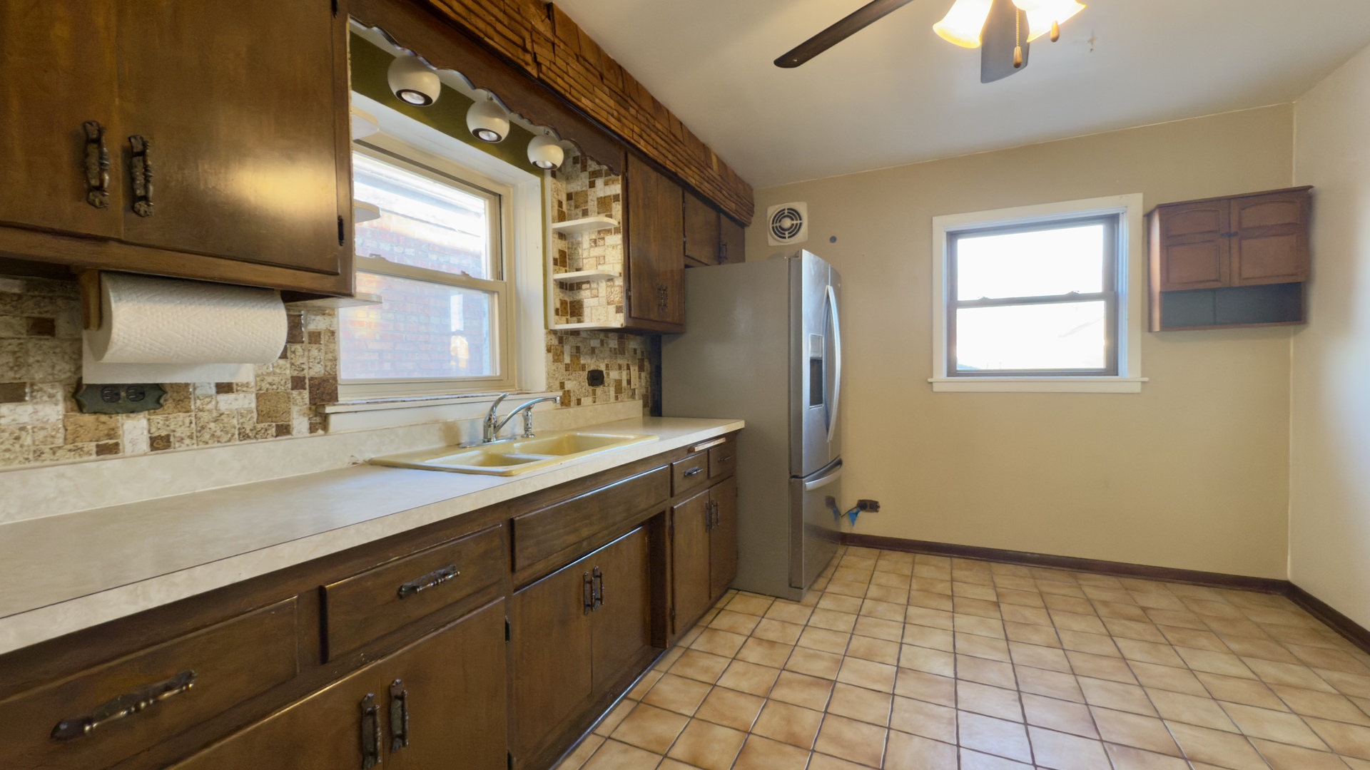 7127 South Ridgeway Avenue Chicago, IL 60629 - Photo 7 of 28 a bathroom with a sink a mirror and a shower