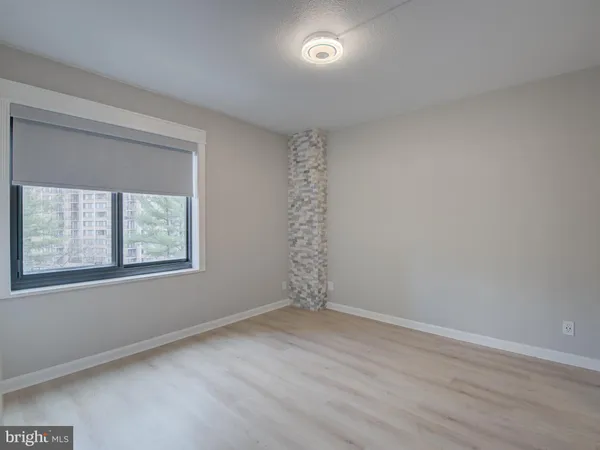 a view of an empty room with a window