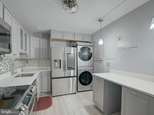 a kitchen with a stove and a refrigerator