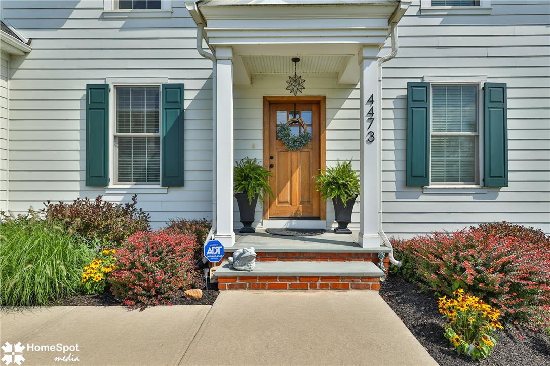 4473 Old Saucon Road Bethlehem, PA 18015 - Photo 2 of 26 An inviting front entry welcomes visitors with structured pillars and classic horizontal siding.