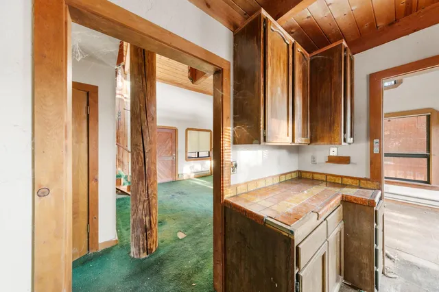 a view of a bathroom from a hallway