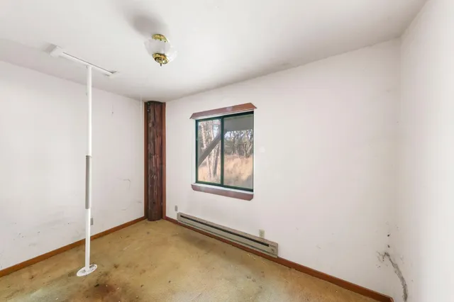 a view of a room that has a door in it