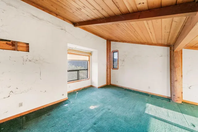 a view of an empty room with windows