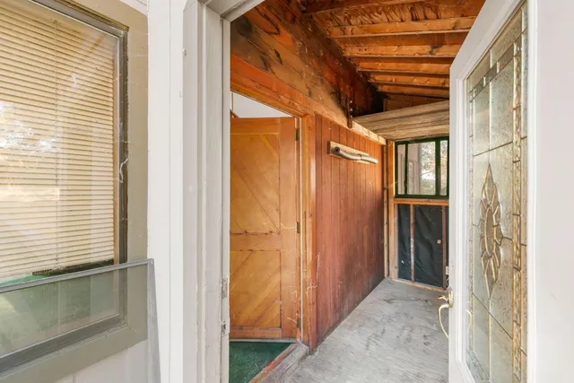 a view of a porch and wooden floor