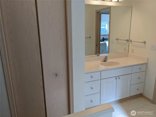 a bathroom with a sink and mirror