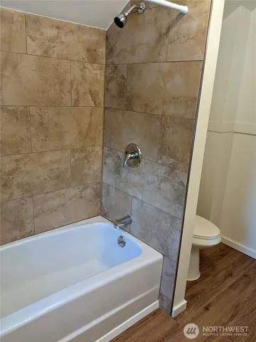 a bathroom with a sink a toilet and a bathtub