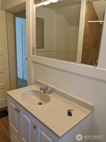 a bathroom with a sink and a mirror