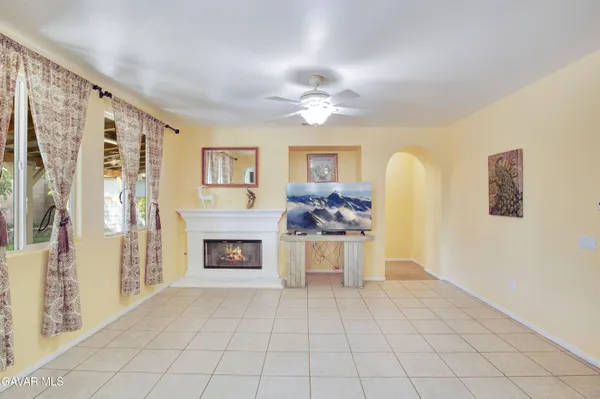 a view of kitchen with furniture and a fireplace