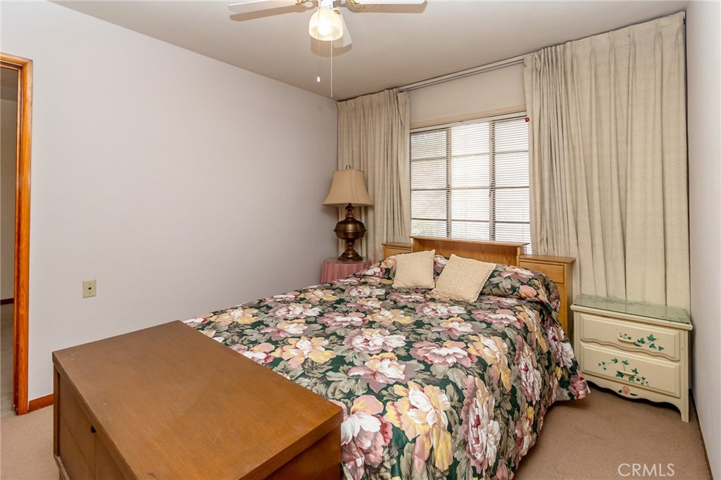 630 Acoma Street Needles, CA 92363 - Photo 21 of 60 a bed sitting in a bedroom next to a window