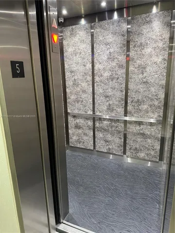 a view of a swimming pool with a lounge chairs