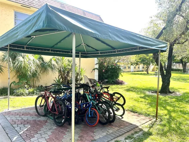 a view of a garden with a bench in the patio