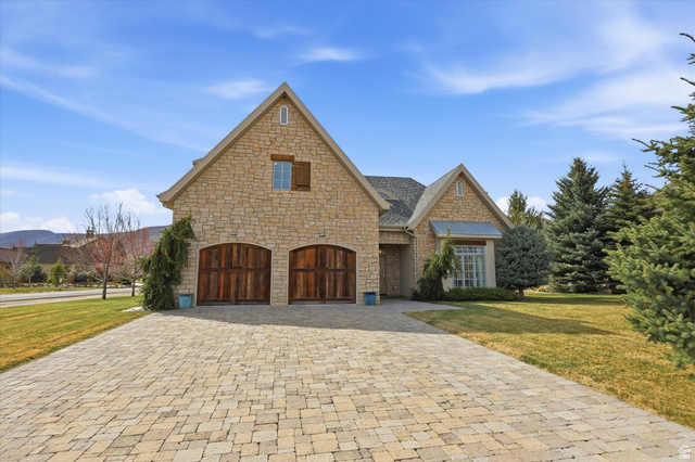 930 Price Farm Court Midway, UT 84049 - Photo 10 of 42 French country style house with a front yard, stone siding, decorative driveway, and an attached garage