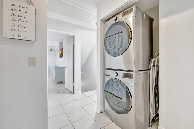 a bedroom with a bed and a lamp