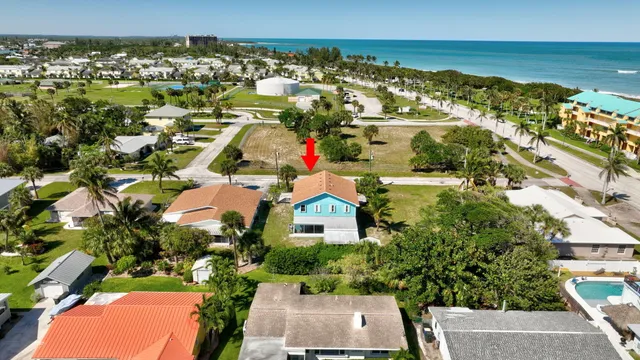 an aerial view of residential houses with outdoor space