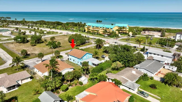 an aerial view of residential houses with outdoor space