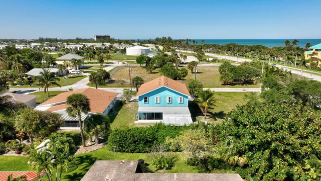 an aerial view of a house with a garden