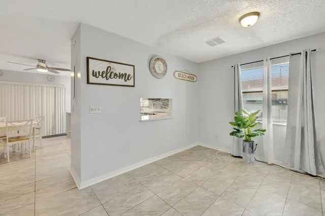 a view of hallway with seating area