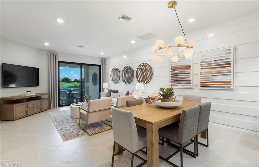 6426 Memorial Lane Ave Maria, FL 34142 - Photo 11 of 38 a view of a dining room with furniture window and wooden floor