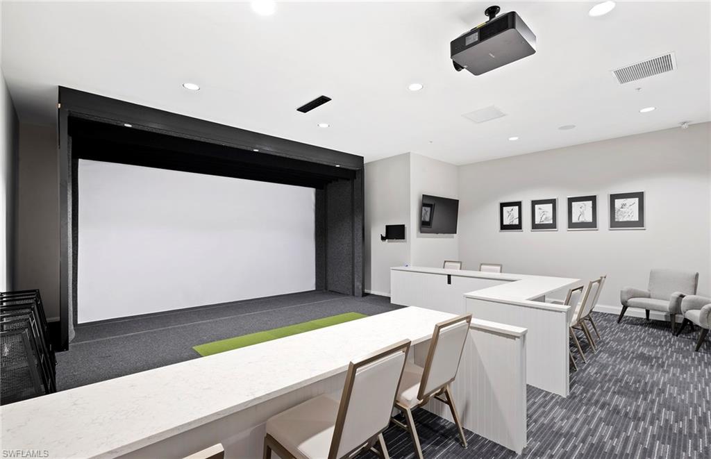 6426 Memorial Lane Ave Maria, FL 34142 - Photo 37 of 38 a living room with stainless steel appliances furniture and a flat screen tv