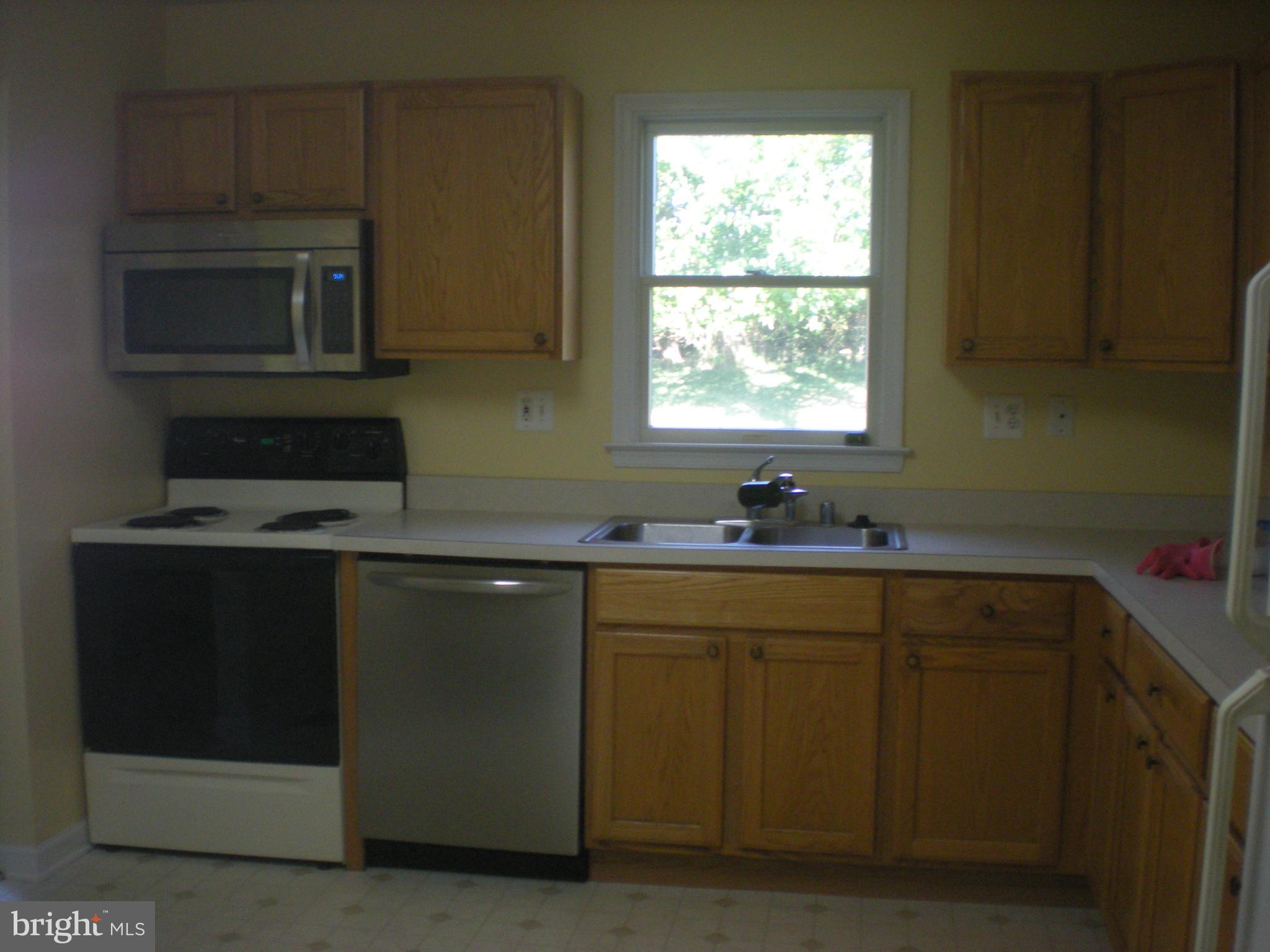 823 Snowfall Way Westminster, MD 21157 - Photo 12 of 23 a kitchen with a sink cabinets and window