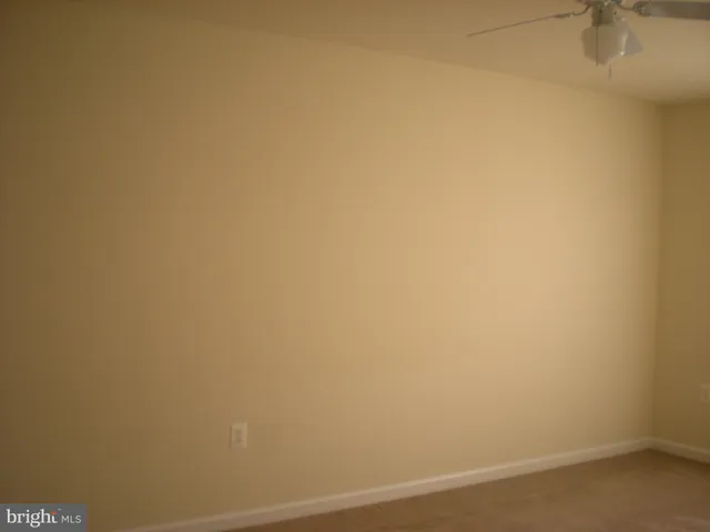 an empty room with a empty space and windows