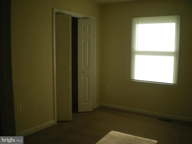 an empty room with a natural light