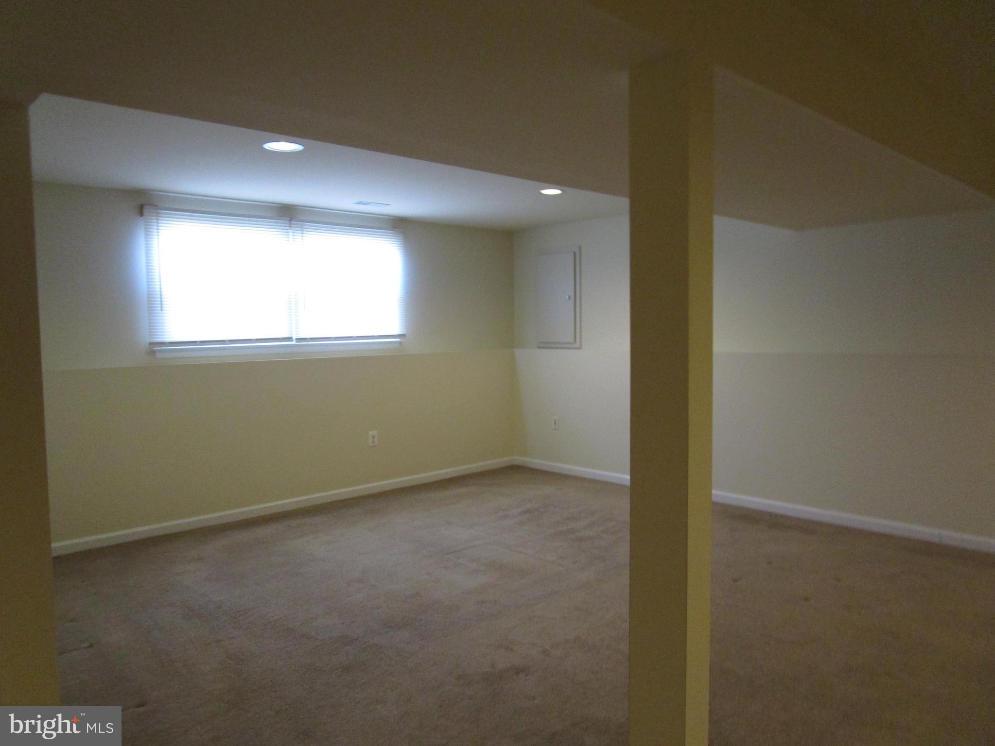 823 Snowfall Way Westminster, MD 21157 - Photo 21 of 23 an empty room with a empty space and windows