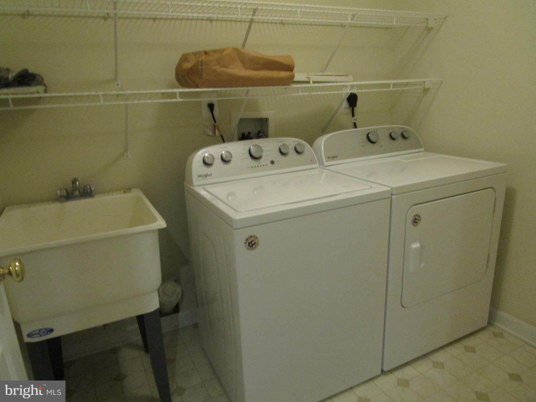 823 Snowfall Way Westminster, MD 21157 - Photo 23 of 23 a utility room with dryer and washer