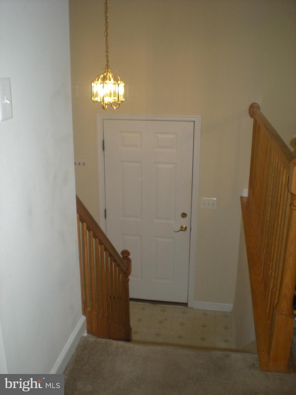 823 Snowfall Way Westminster, MD 21157 - Photo 7 of 23 a view of a hallway with a chandelier