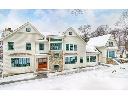 a front view of a residential apartment building with a yard