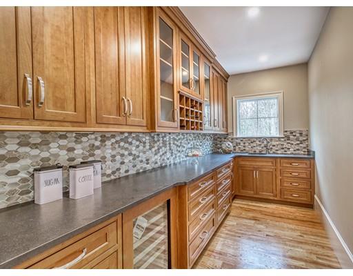 10 Russell Road Lexington, MA 02420 - Photo 15 of 29 a kitchen with granite countertop stainless steel appliances a sink and cabinets