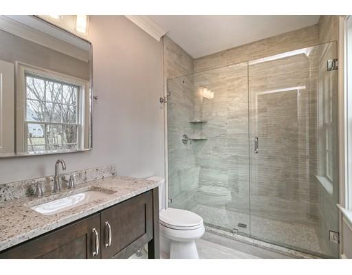 10 Russell Road Lexington, MA 02420 - Photo 19 of 29 a bathroom with a granite countertop sink toilet and shower