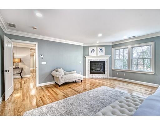 10 Russell Road Lexington, MA 02420 - Photo 21 of 29 a bedroom with a bed and wooden floor