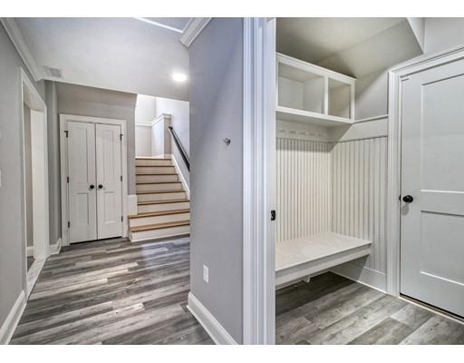 10 Russell Road Lexington, MA 02420 - Photo 25 of 29 a view of a bedroom with wooden floor and white walls