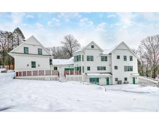 10 Russell Road Lexington, MA 02420 - Photo 28 of 29 a view of a white house with a yard in front of it